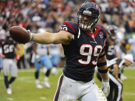 jj-watt-handing-ball.jpg